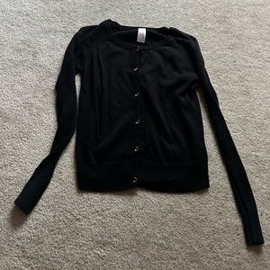 Youth black sweater but can fit adults. 10-12 in youth size.
